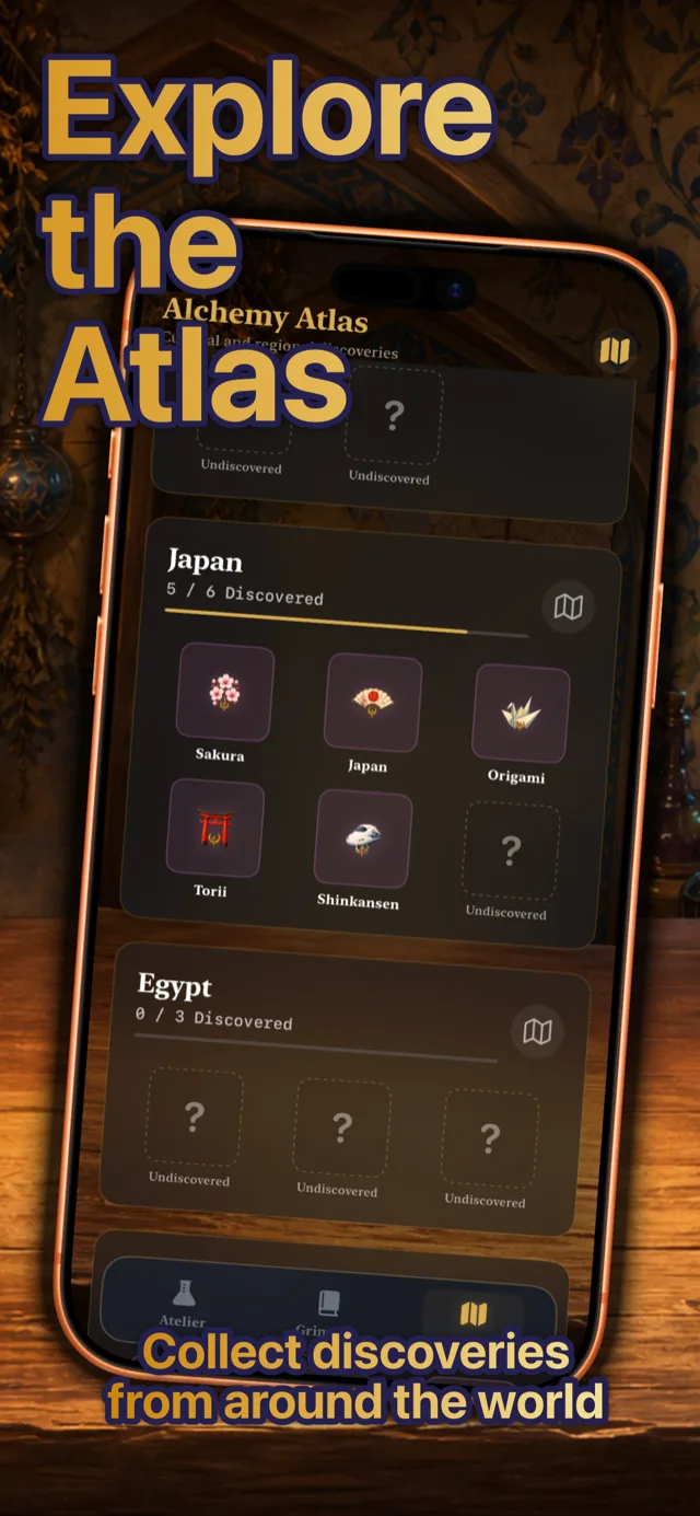 The Alchemy Atlas screen showing the Japan collection with Sakura, Origami, Torii, and Shinkansen, plus an Egypt collection below.